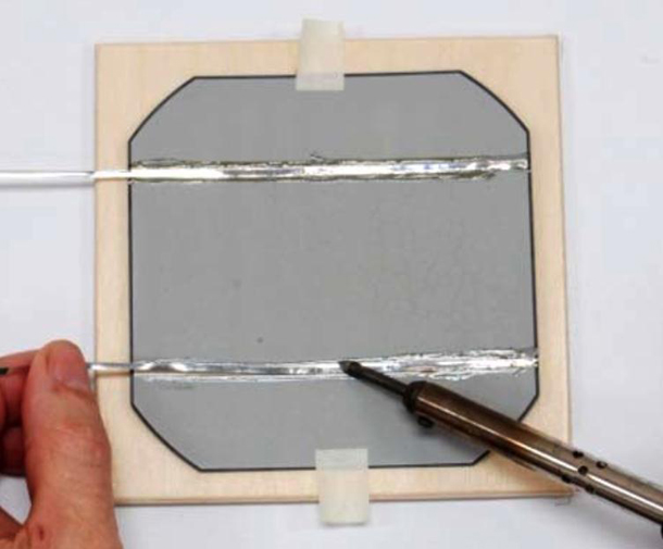 Adding the tabbing wires on one of the solar cells in the Parallax 33000-ND panel kit Parallax solar panel kit